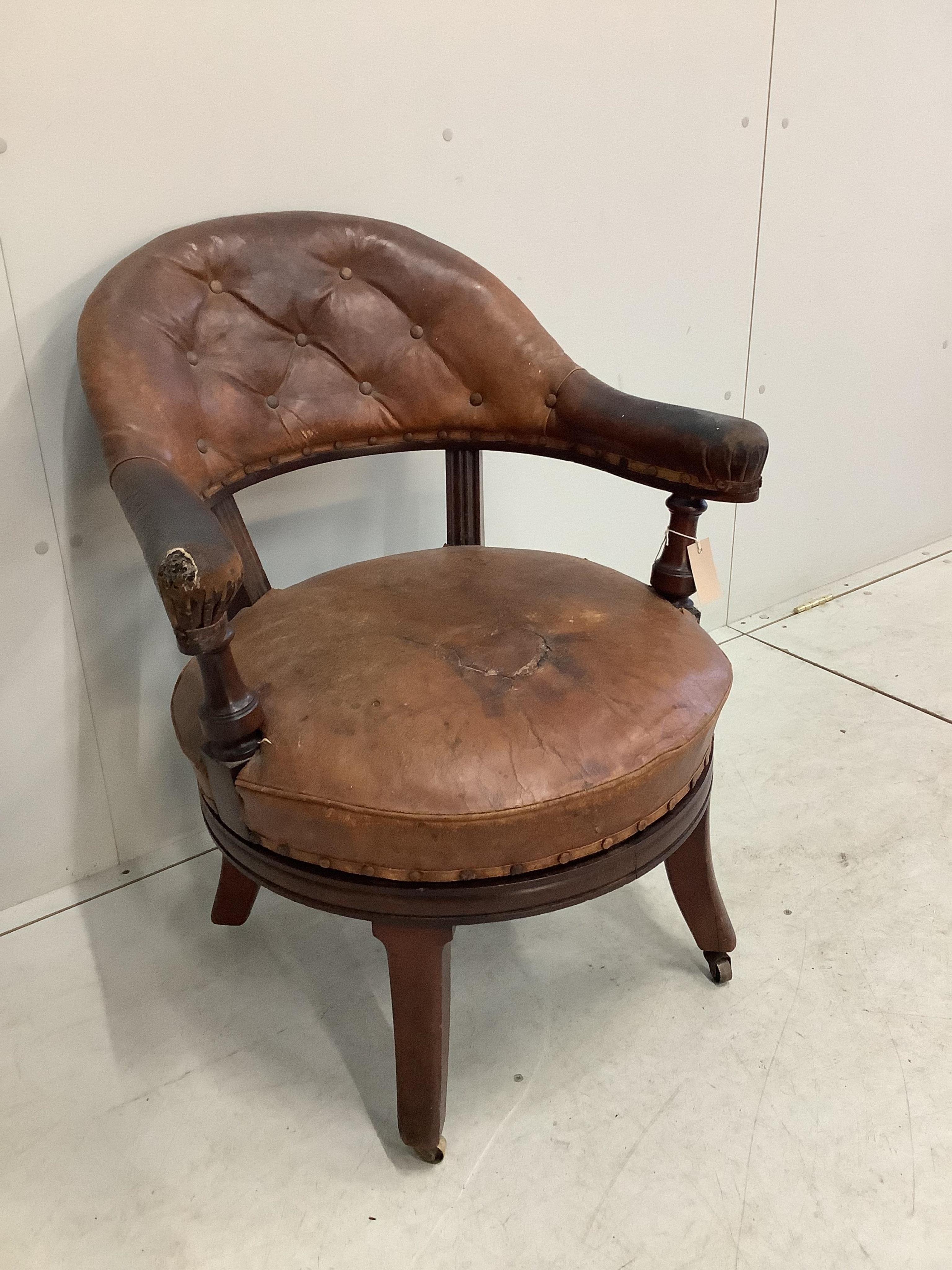 A 19th century Holland & Son leather button back office chair (missing one castor), width 65cm, depth 56cm, height 80cm. Condition - poor